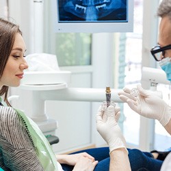 A woman at a dental implant consultation