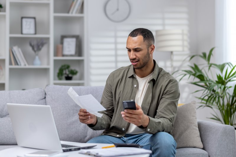 Patient anxiously budgeting for dental emergencies