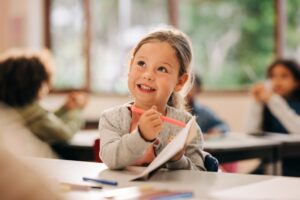 Dentist smiling while at school
